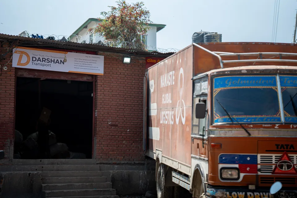 Truck parked at the Darshan Transport depot entrance