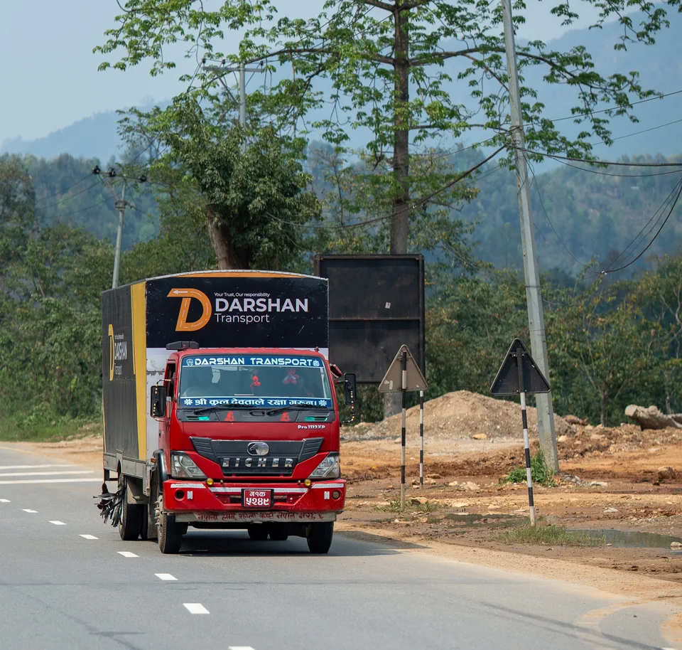 Darshan Transport truck on a clear mountain road