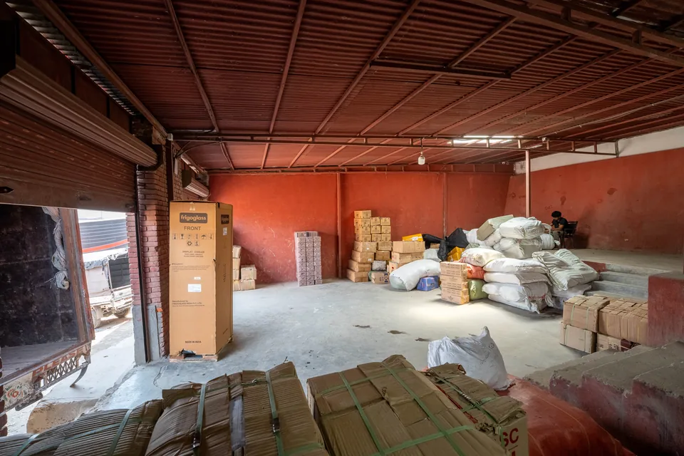 Cargo boxes stored inside a Darshan Transport warehouse